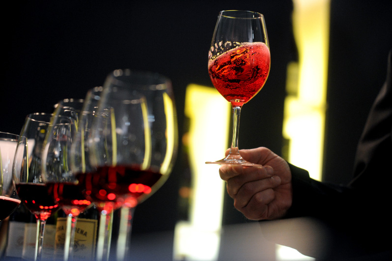 Goblets of red wine at wine fair Italy